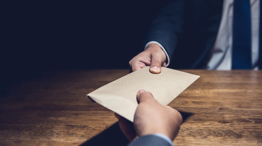 Bribery concept with envelope