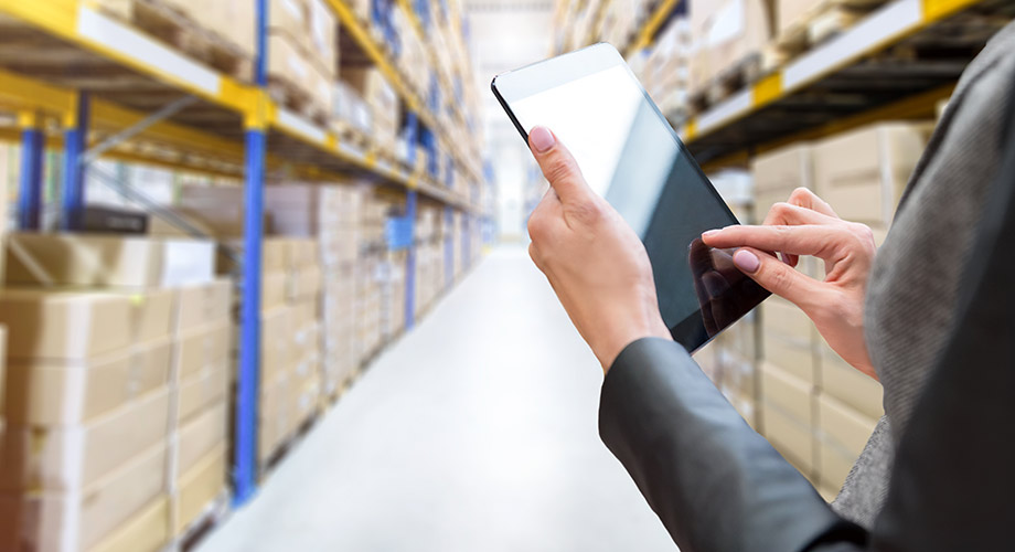 Person holding a table in a warehouse